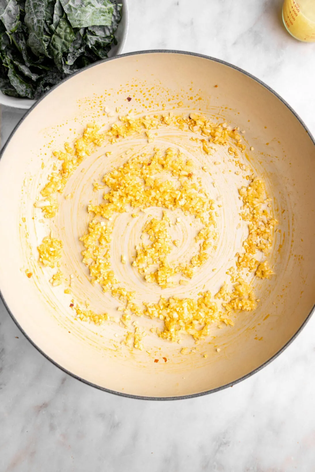 step by step photo: sautéing the base, onions and garlic