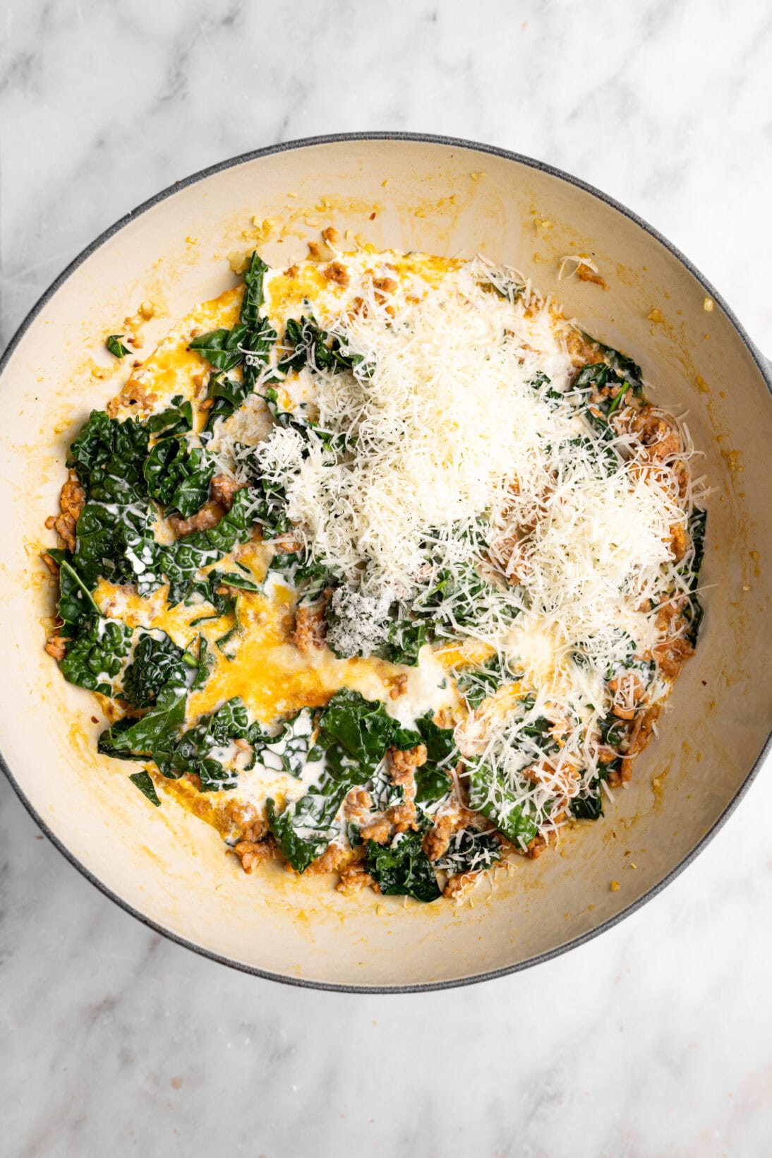 step by step photo: added the heavy cream and Parmesan cheese.