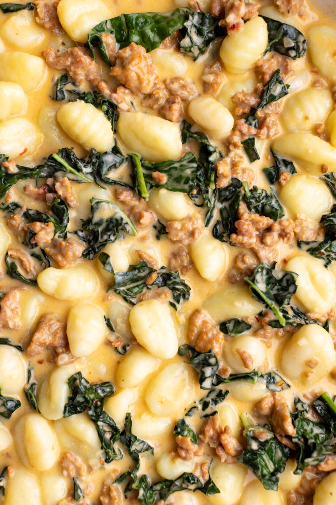 up close shot of creamy Tuscan gnocchi