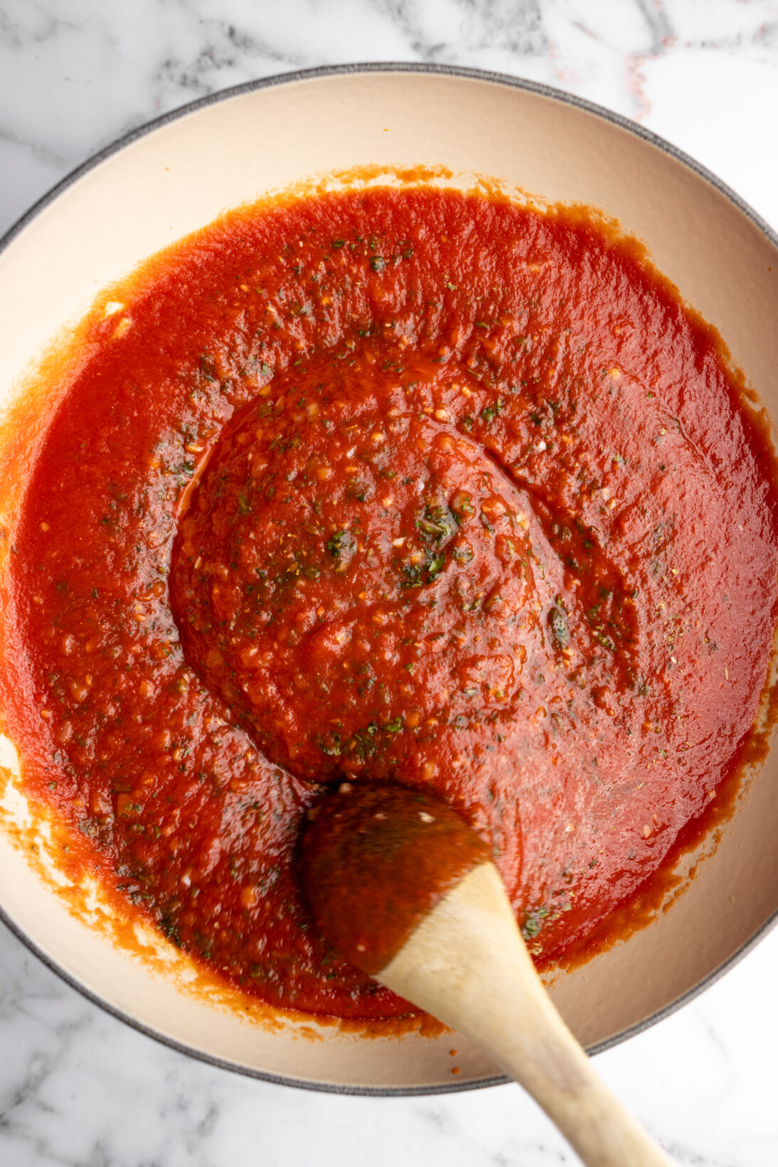 the sauce after simmering with basil, and oregano.