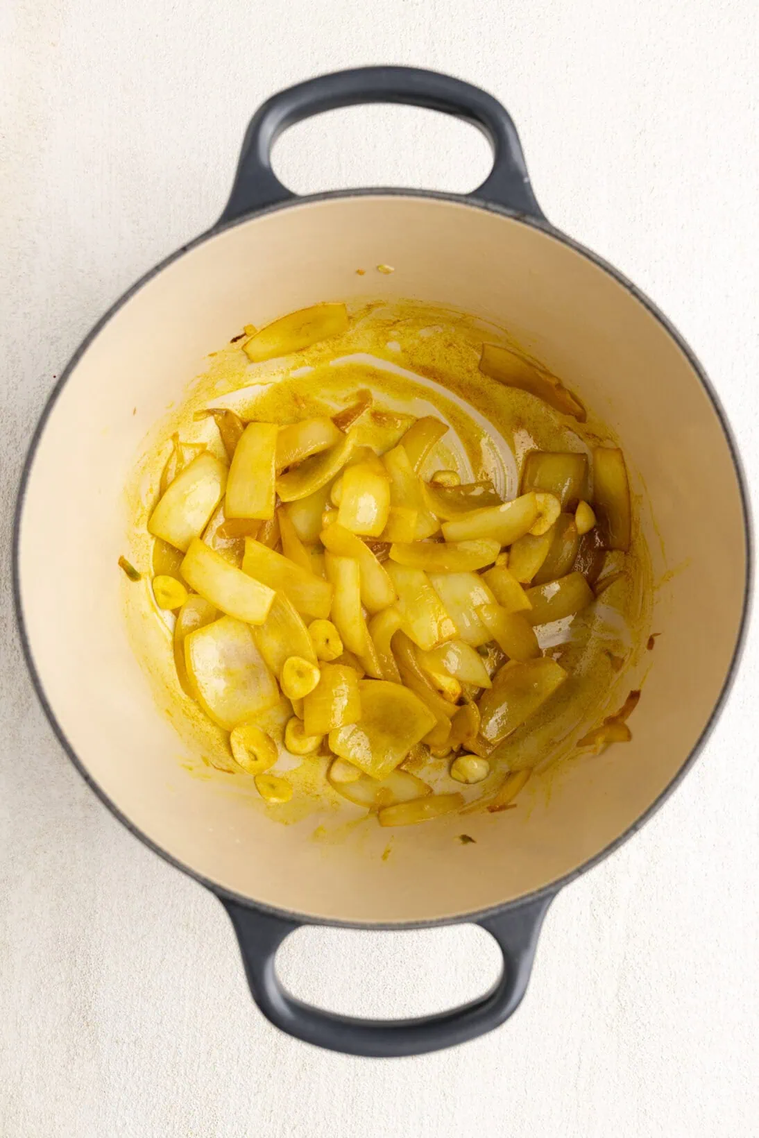 step by step: sautéing the onions, garlic in turmeric
