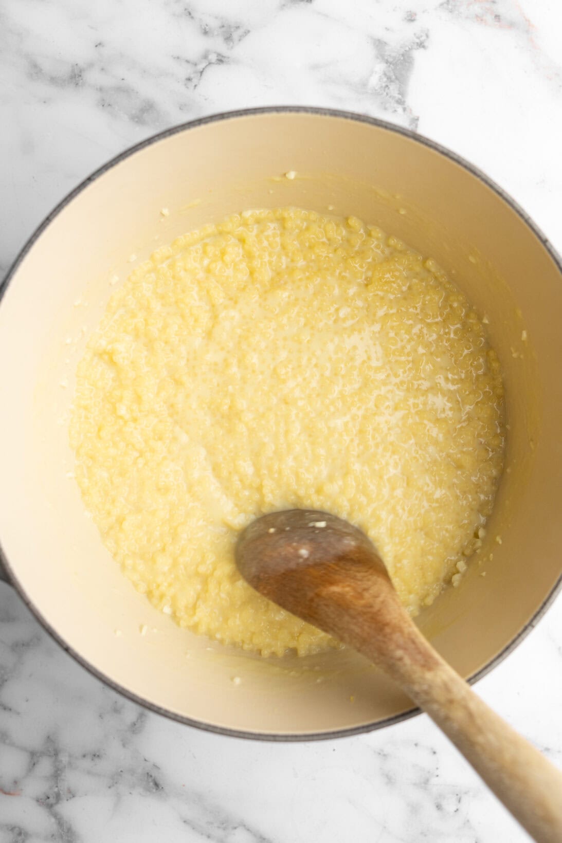 cooking the Greek lemon pastina until aldente and loose.