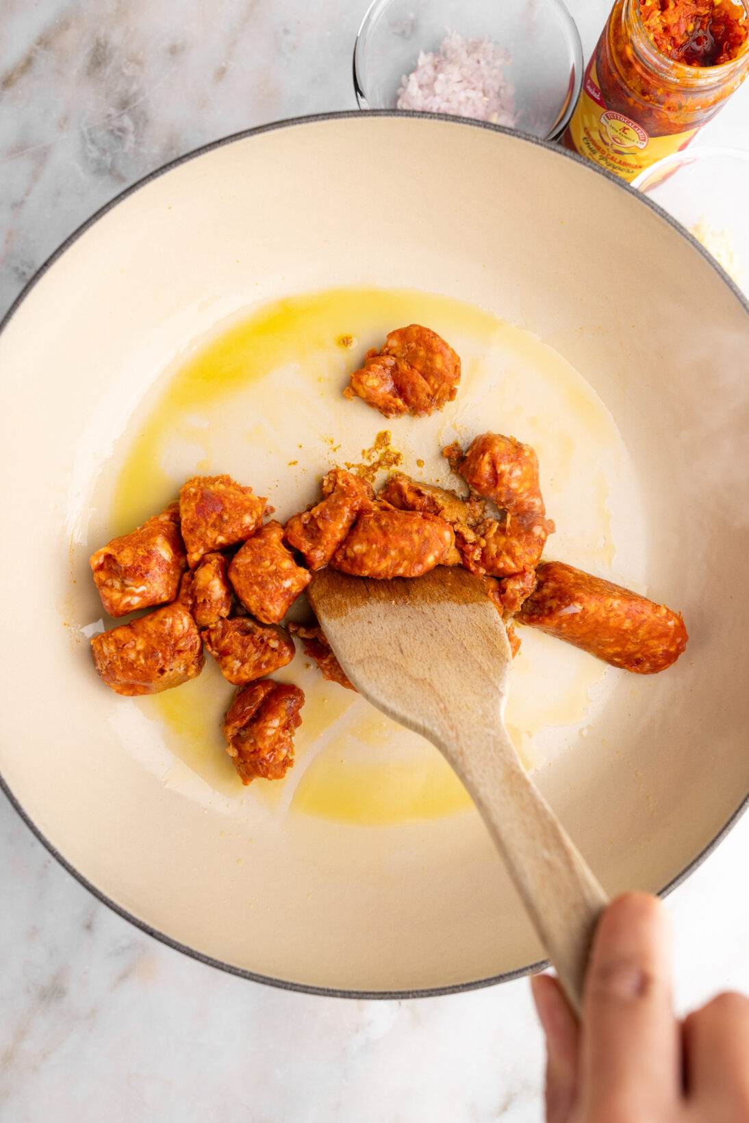 step by step: breaking up the sausage