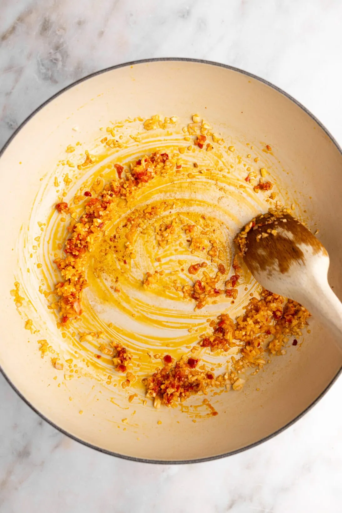 step by step: sautéing the Calabrian and garlic in the pan.