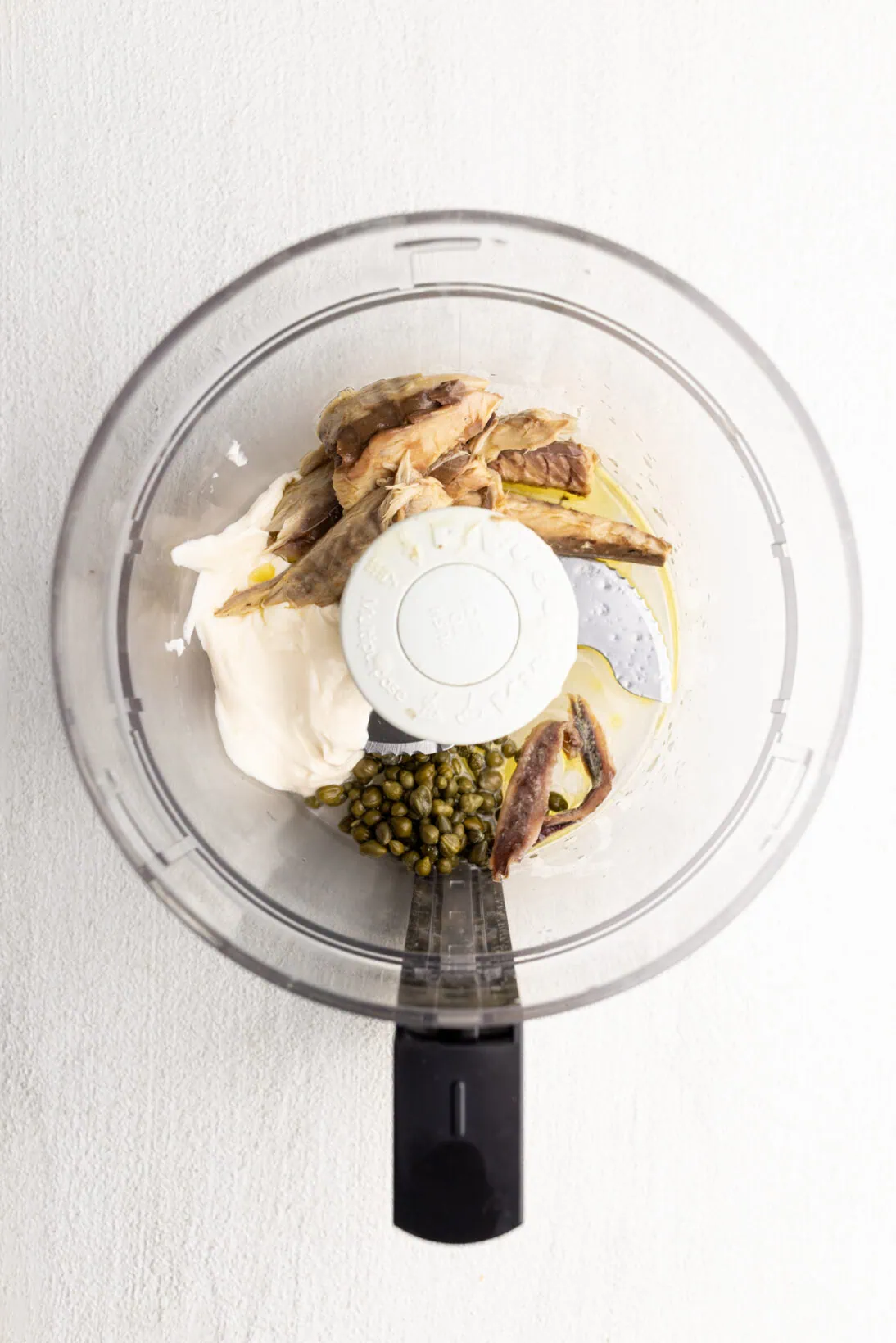 the ingredients for tonnato in a food processor. 