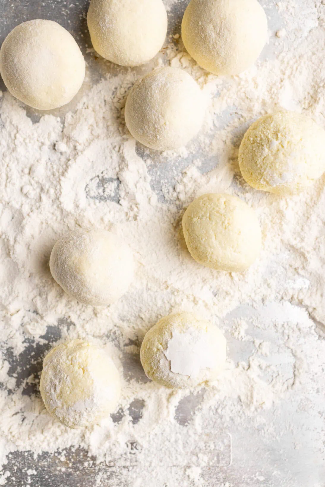 raw rolled out ricotta gnudi.