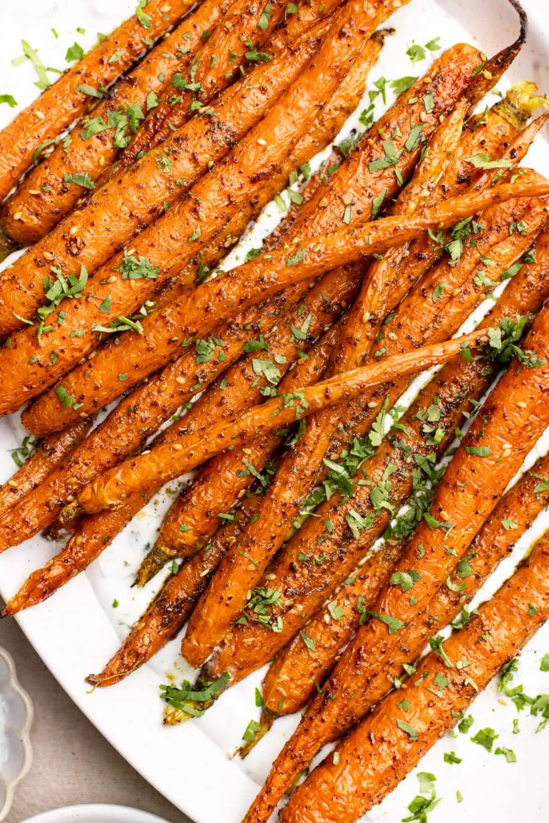 za'atar roasted carrots over a garlicky yogurt sauce
