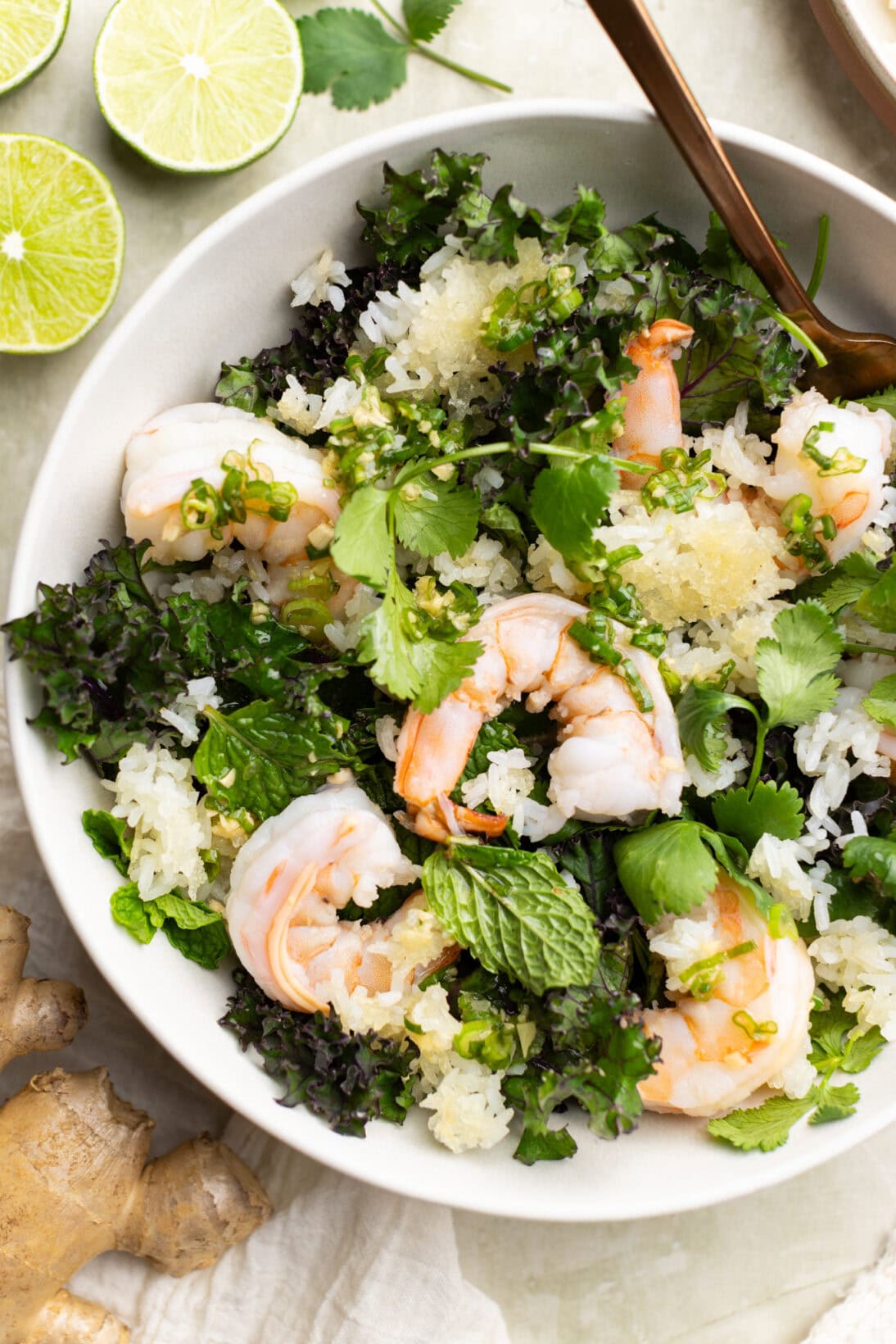 crispy rice salad with shrimp, cilantro, kale and mint. Dressed in a homemade ginger and green onion dressing.
