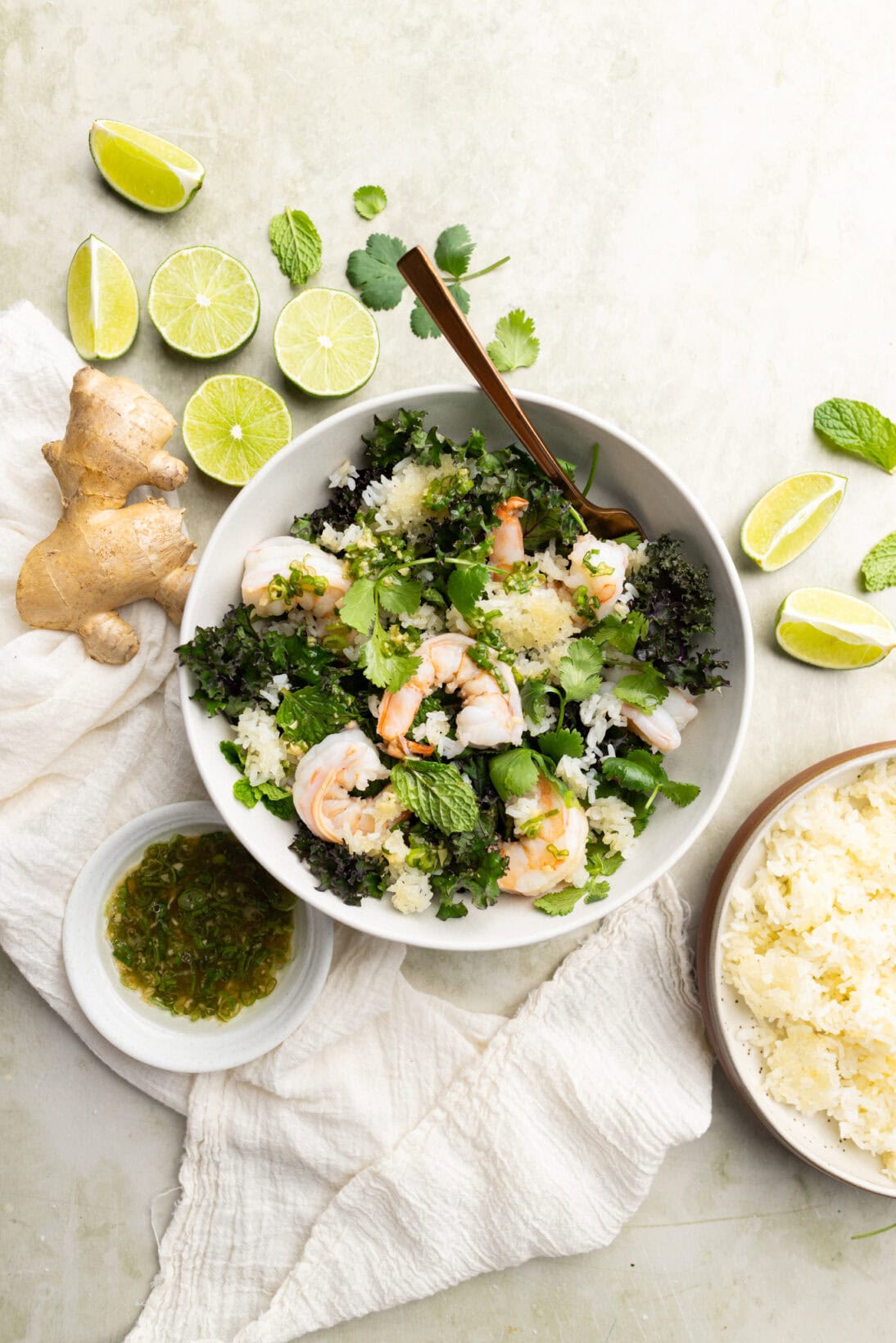 crispy rice salad with shrimp, cilantro, kale and mint. Dressed in a homemade ginger and green onion dressing.