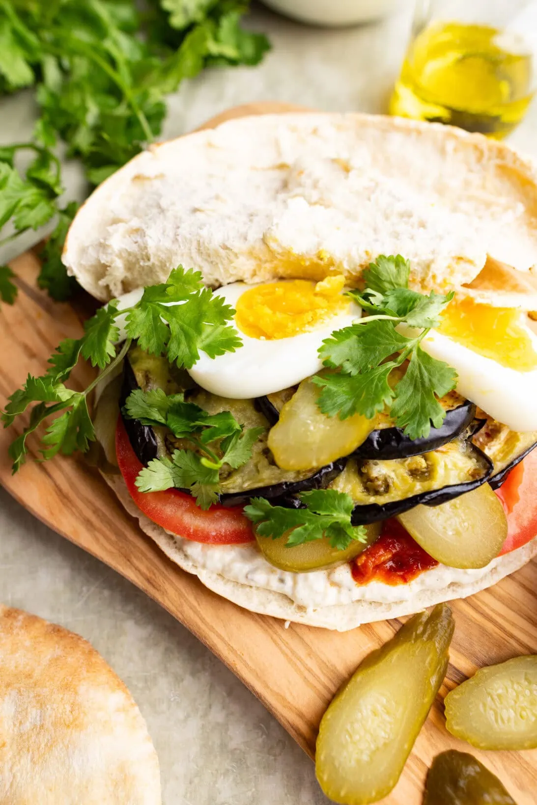 open sabich sandwich on a cutting board