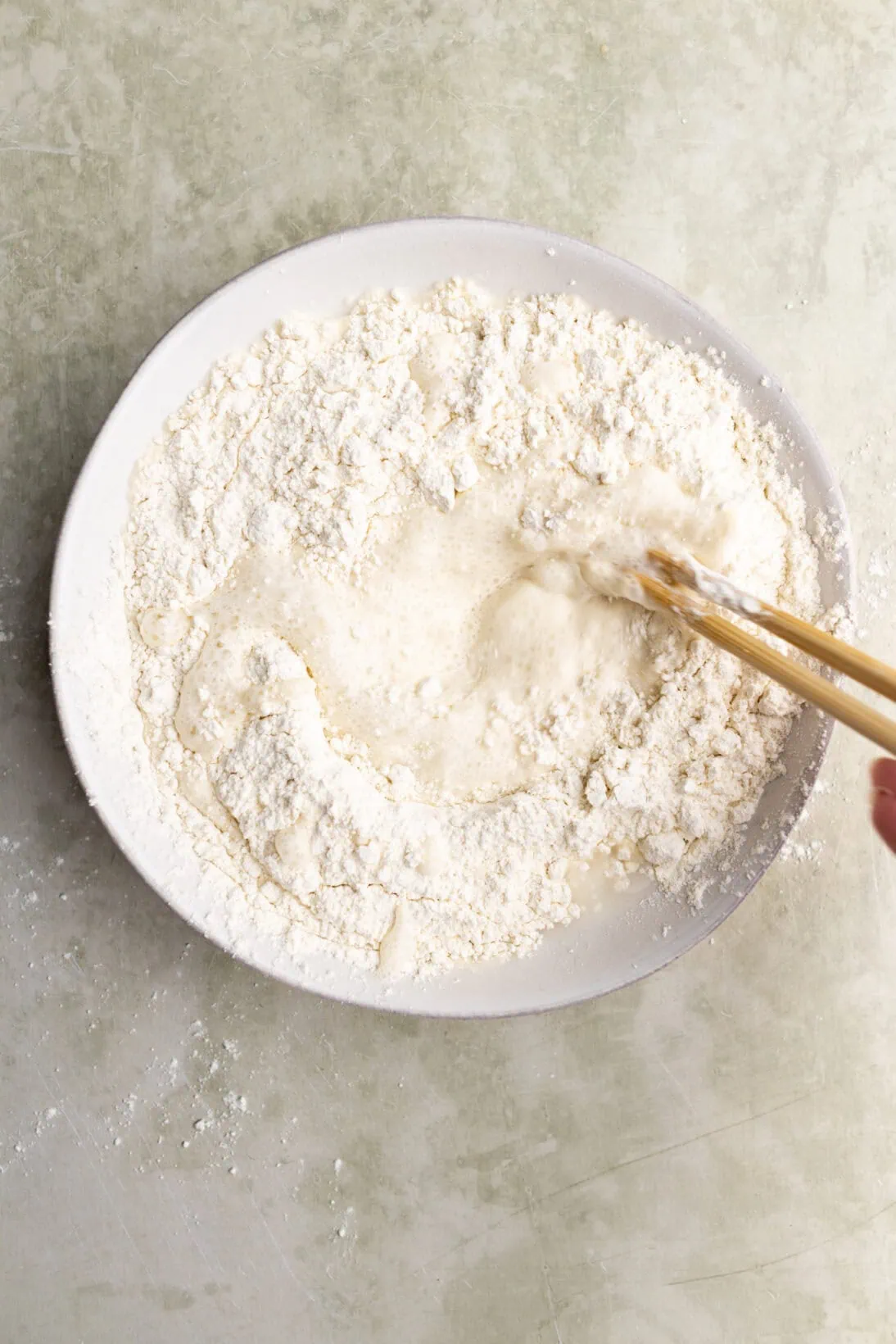 mixing the tempura mix with chopsticks