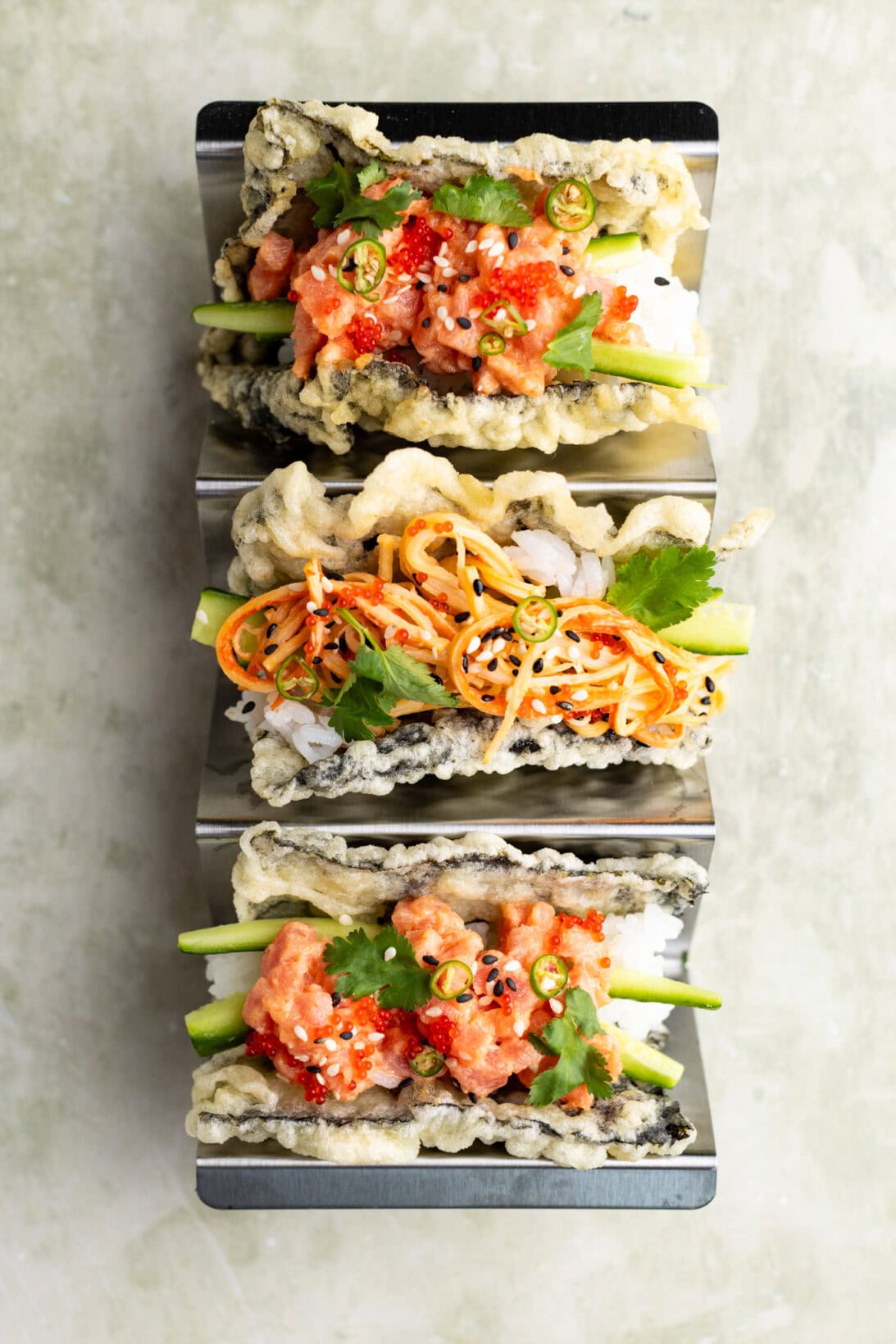 sushi tacos filled with spicy tuna and spicy kani