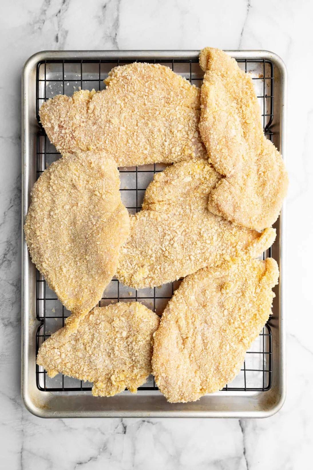 a tray of pre-breaded chicken cutlets