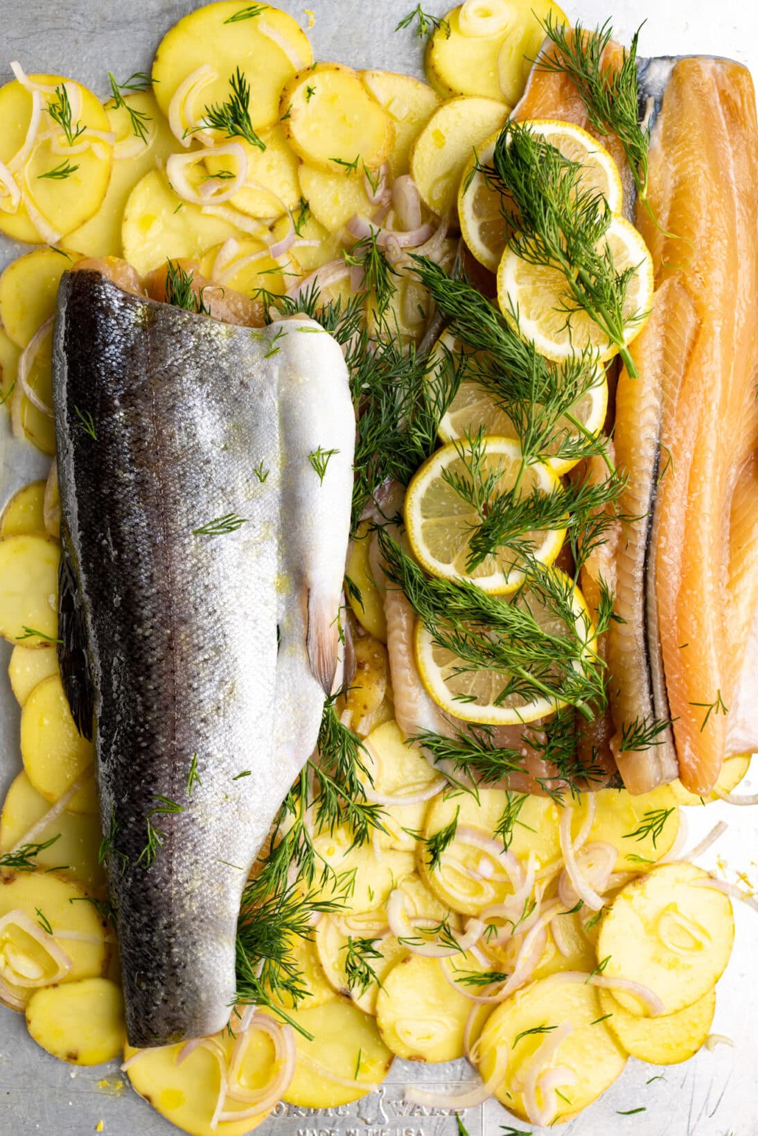 uncooked butterflied trout fillets stuffed with lemon and dill