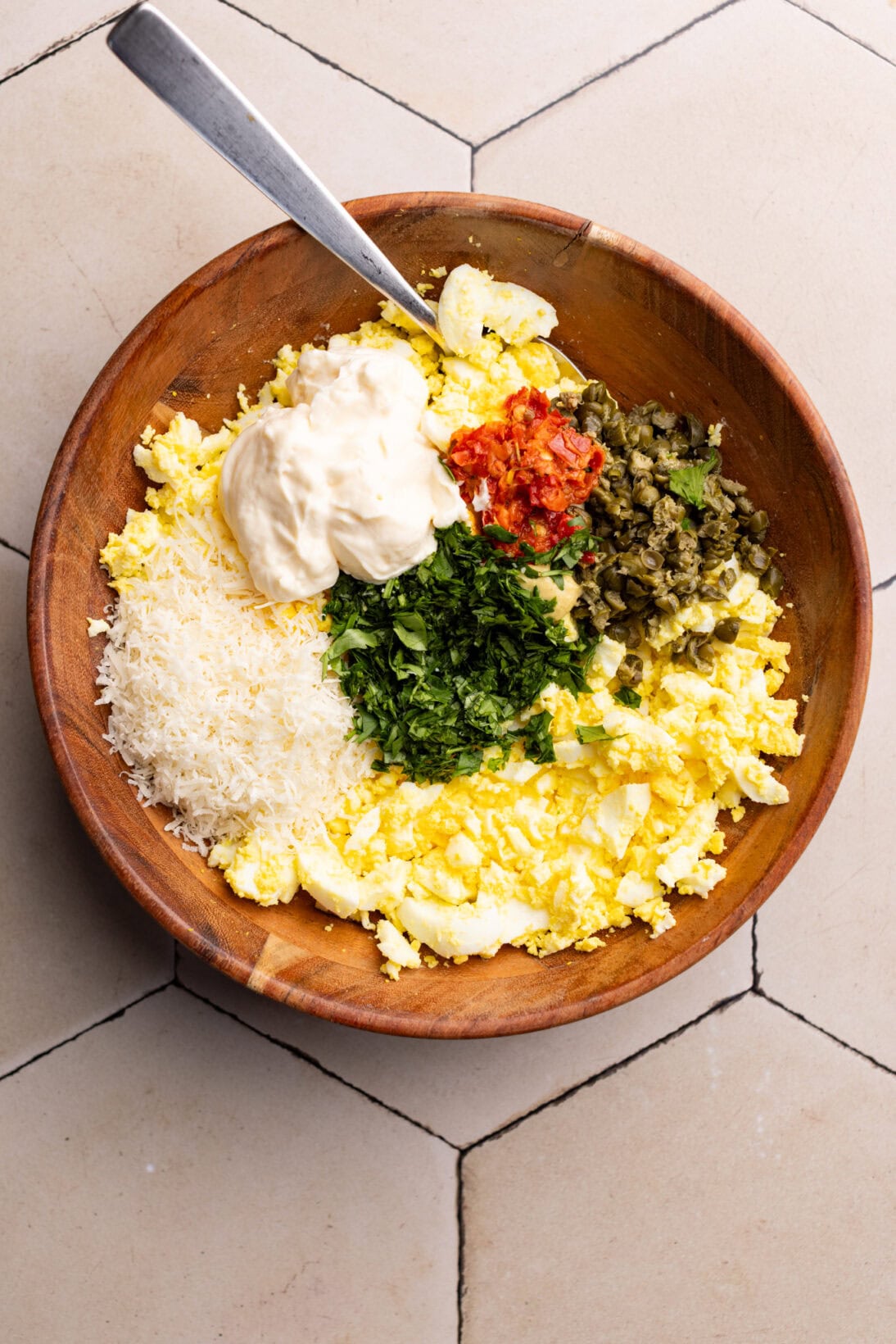 bowl of ingredients for spicy egg salad