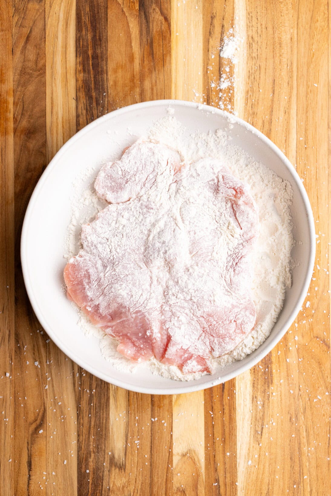 coating the cutlet in flour
