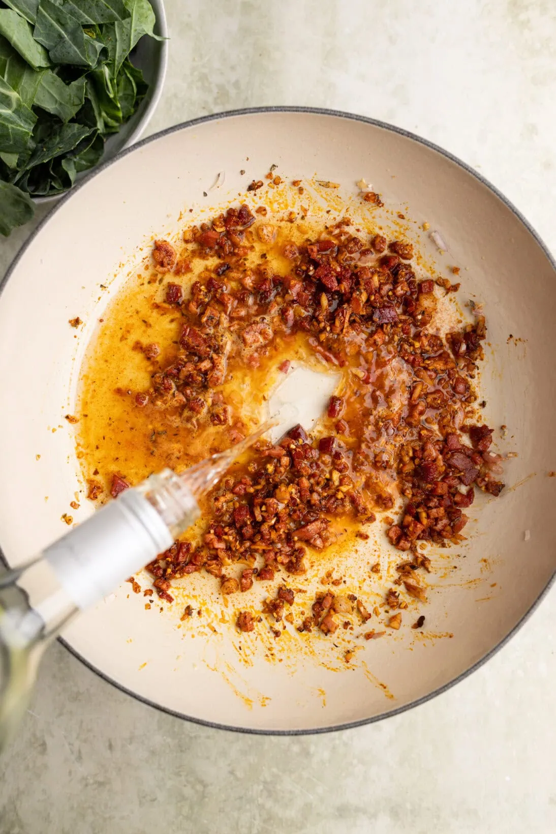 step by step: adding the wine to the speck, garlic, shallots, and spices
