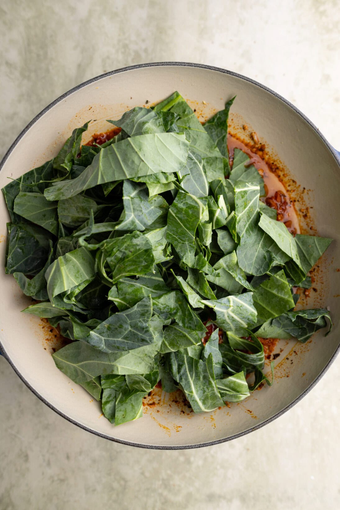 step by step: adding the uncooked collared greens