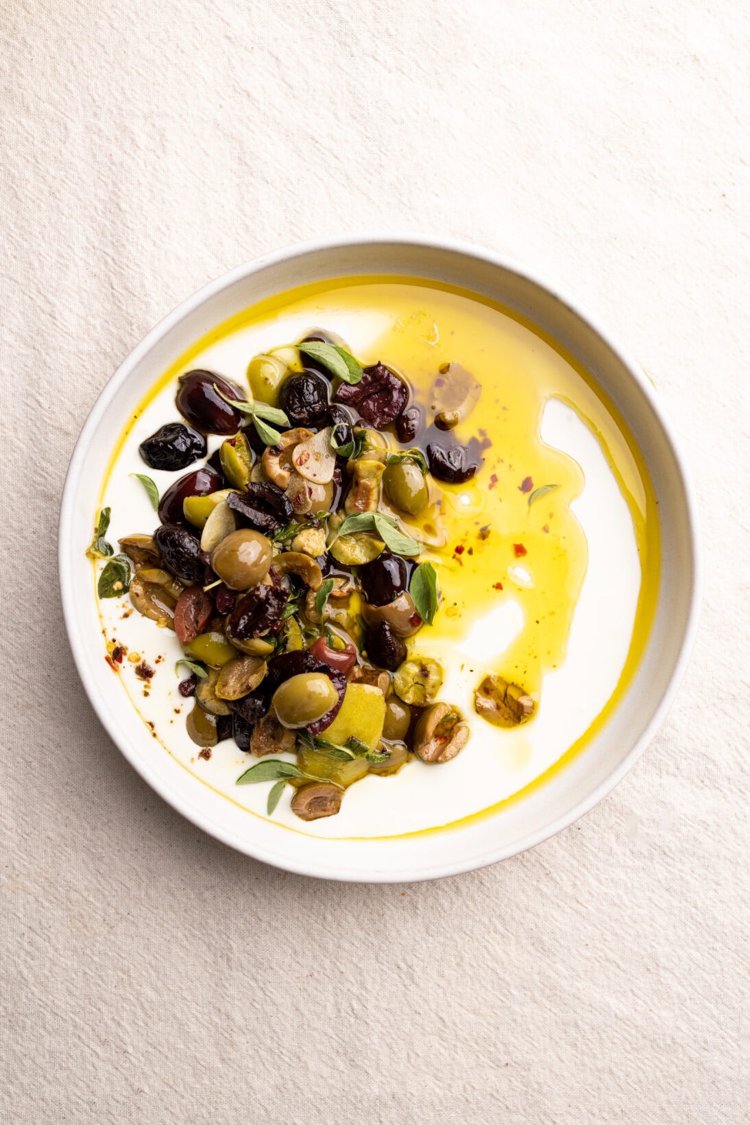 bowl of warm olives over whipped feta