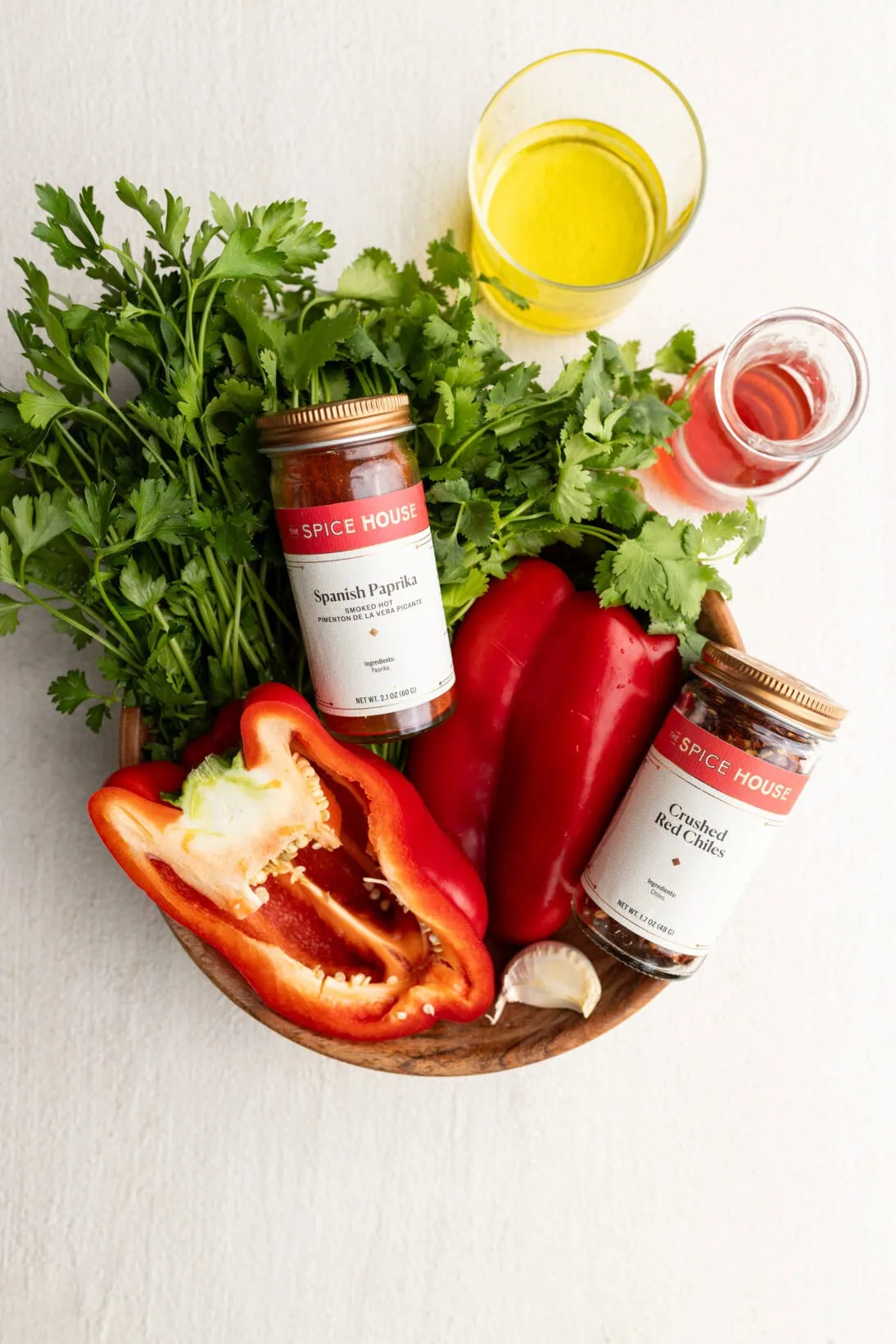 ingredients : olive oil, red wine vinegar, smoked paprika, chili flakes, red bell pepper, cilantro, parsley. 