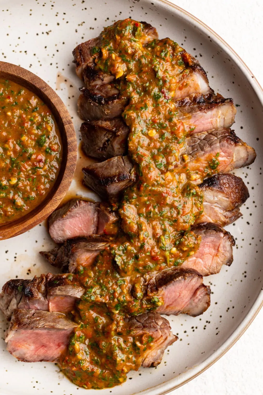 steak covered in red chimichurri