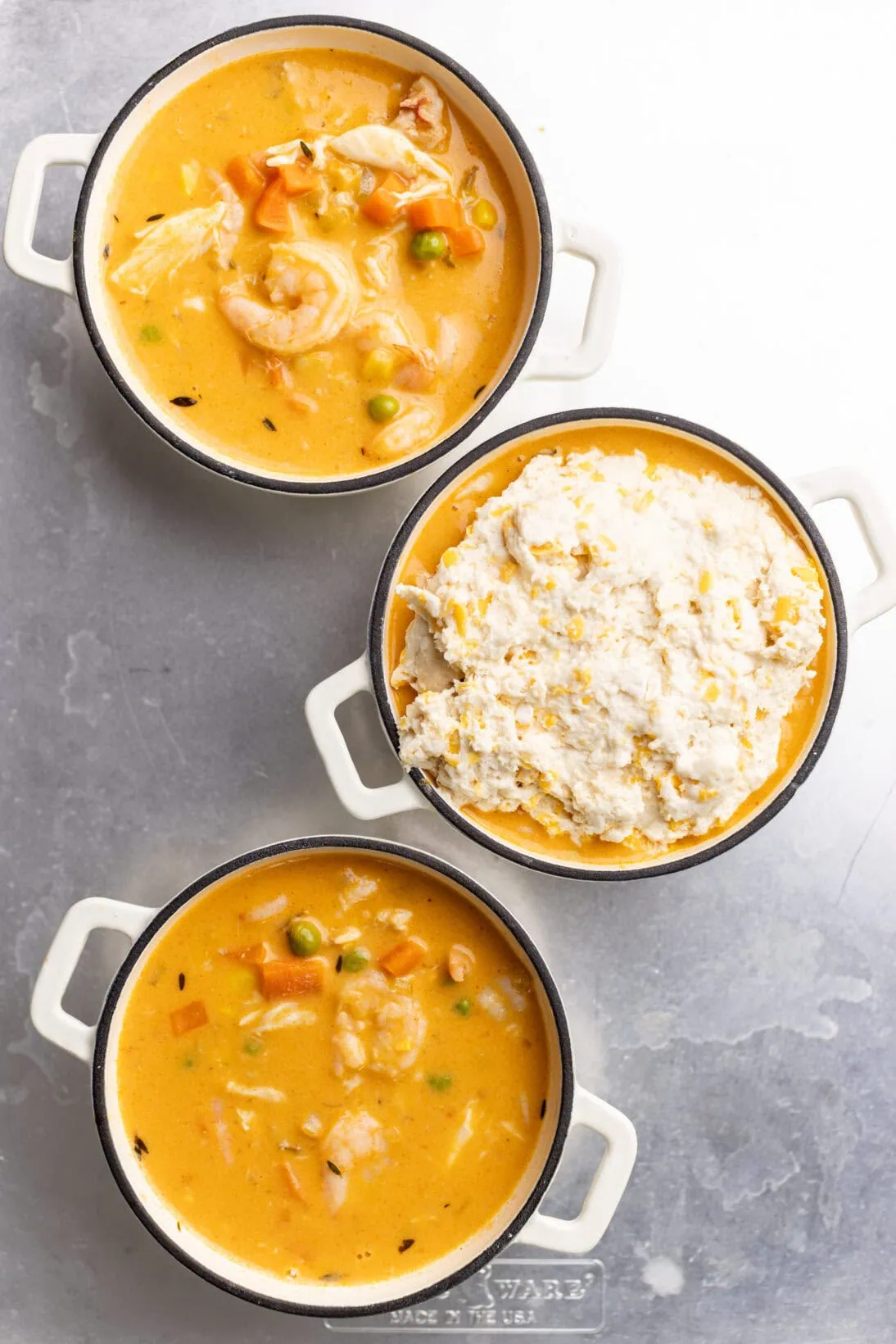 step by step: dishing out the seafood pot pies and topping them with cheddar bay biscuits