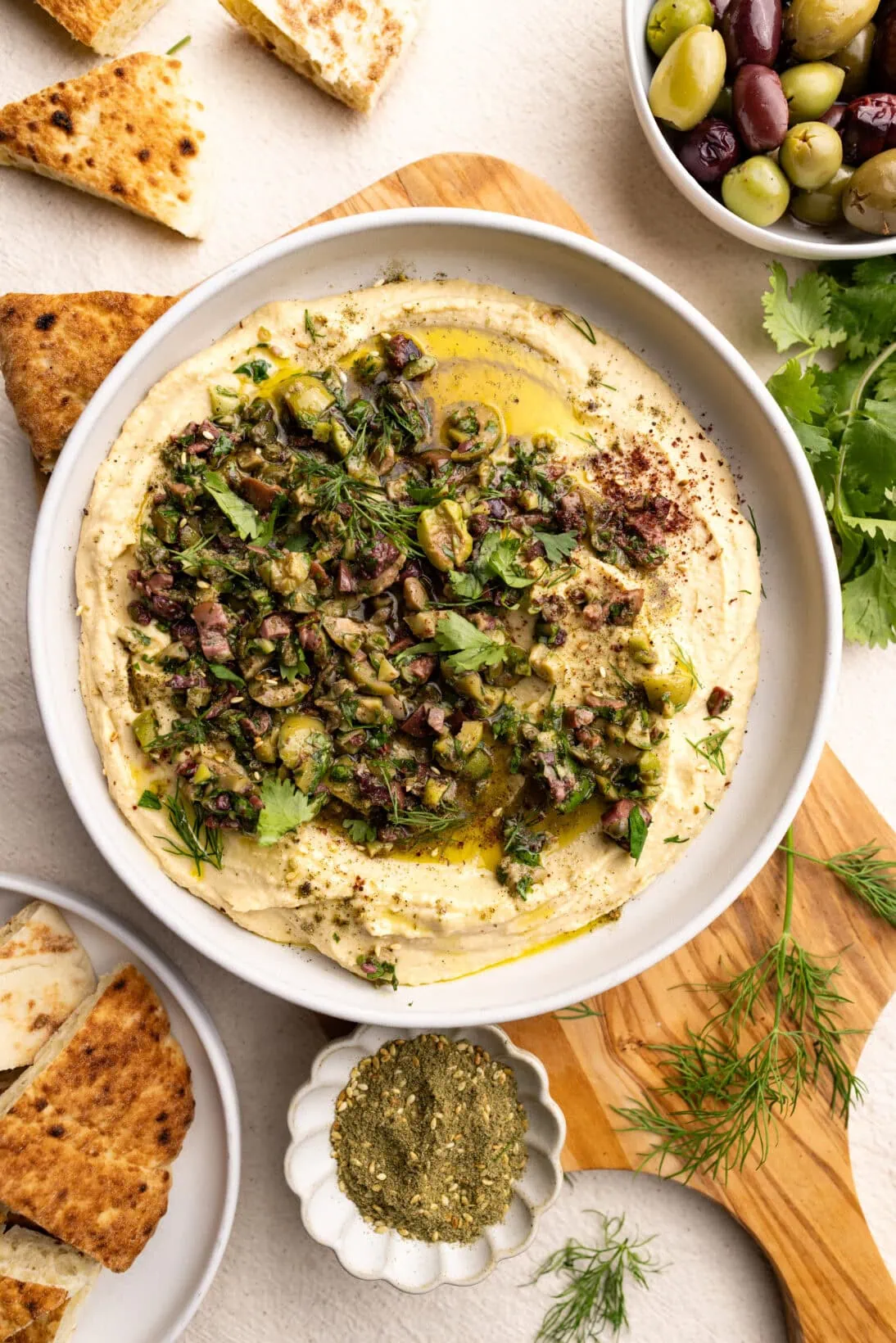 a bowl of olive tapenade hummus 