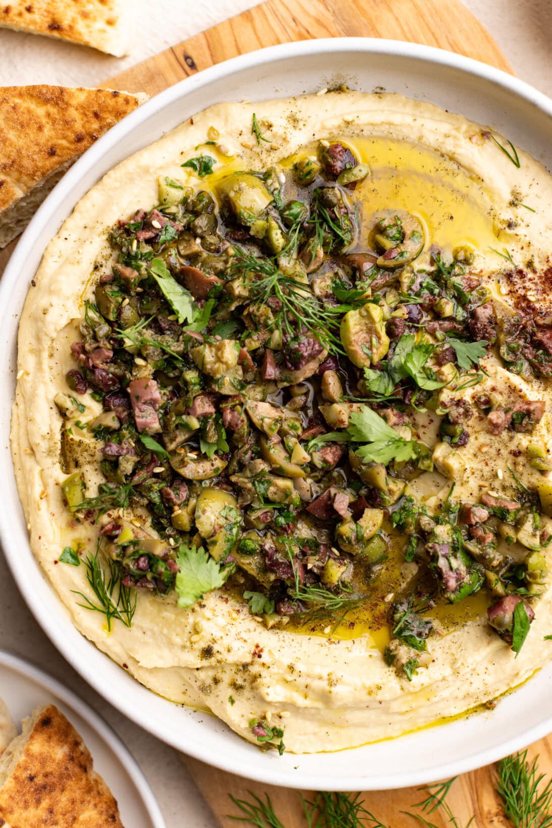 a bowl of olive tapenade hummus 