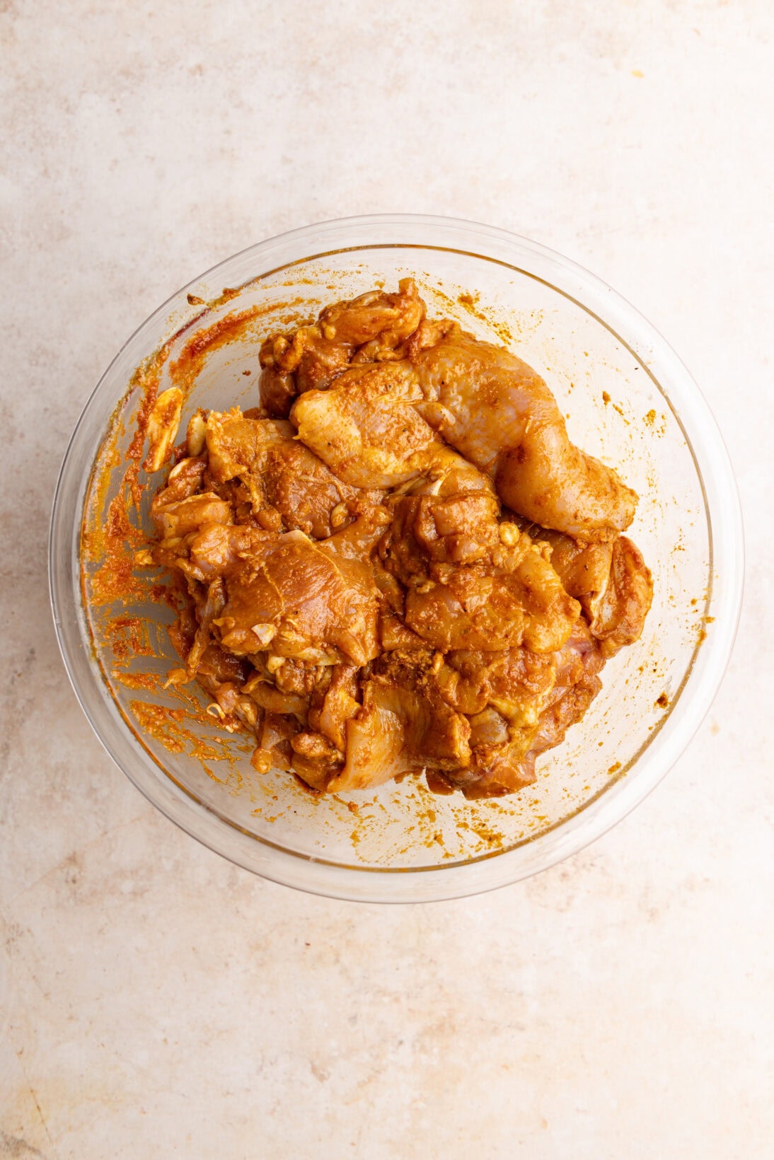 mixing the chicken with the seasonings