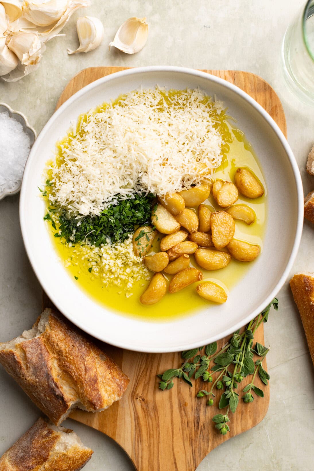 garlic bread dipping oil ( garlic confit, parm, parsley, and raw garlic) in a bowl.