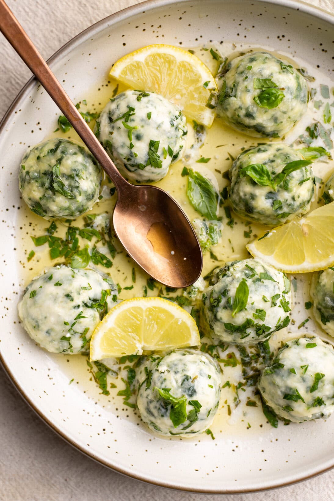 low bowl of spinach and ricotta gnudi.