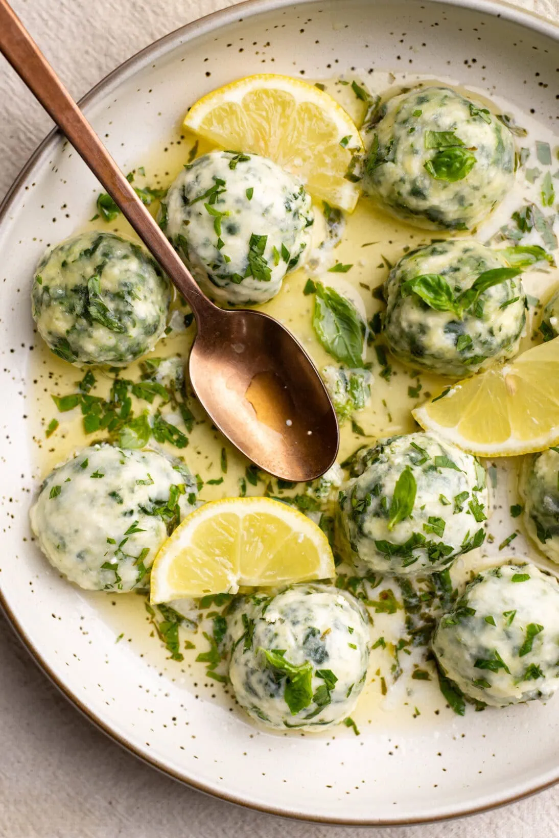 low bowl of spinach and ricotta gnudi.