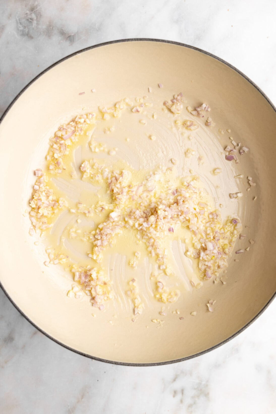 step by step: cooking the garlic and shallots in butter.