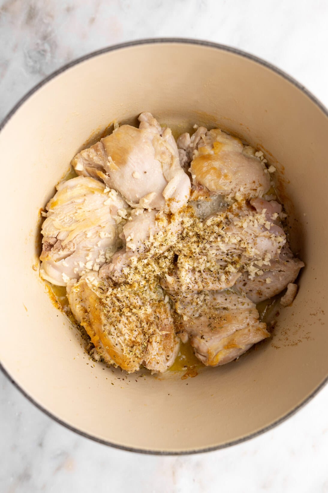 step by step: adding the garlic, oregano and cumin