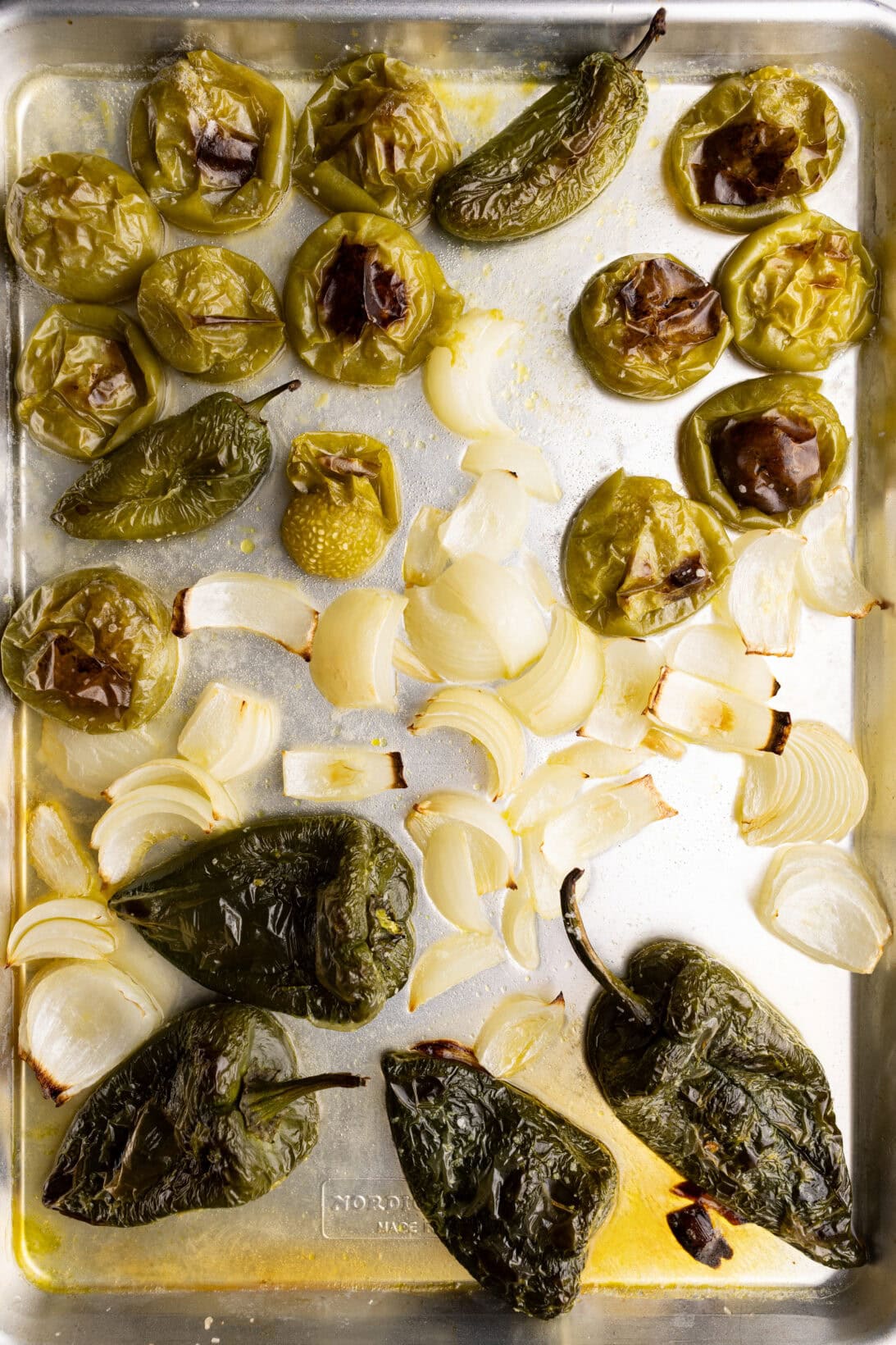 roasting the poblano peppers, onions, tomatillos, and jalapeños