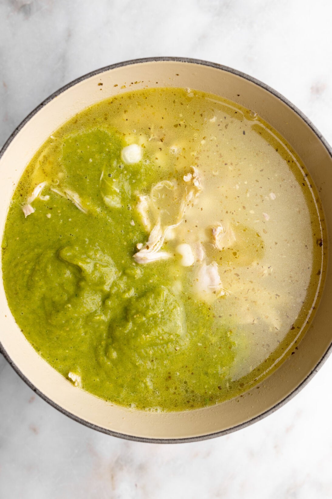 step by step: adding the puree to the chicken pozole