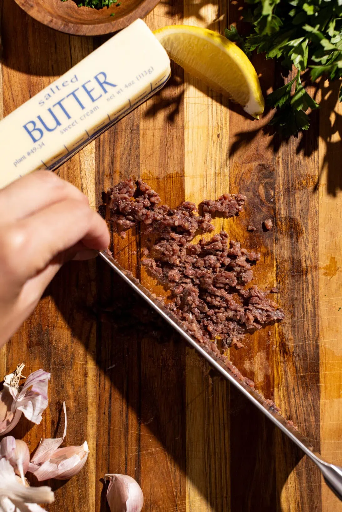 step by step: chopping the anchovies to create a paste