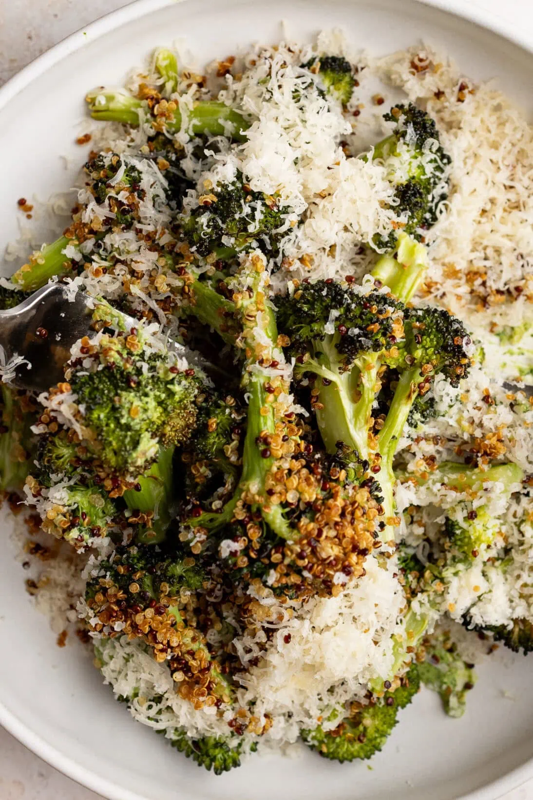 roasted broccoli salad topped with crispy quinoa and a mountain of Gouda cheese.
