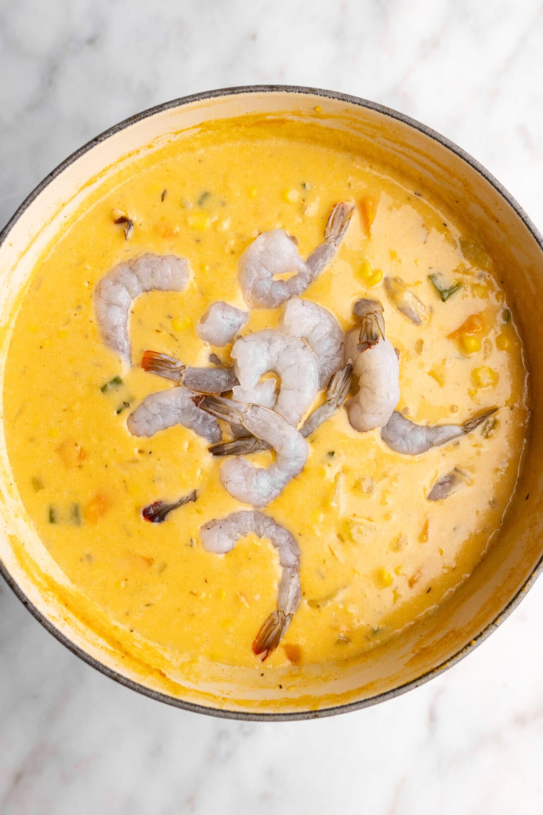 step by step: adding the shrimp to the chowder