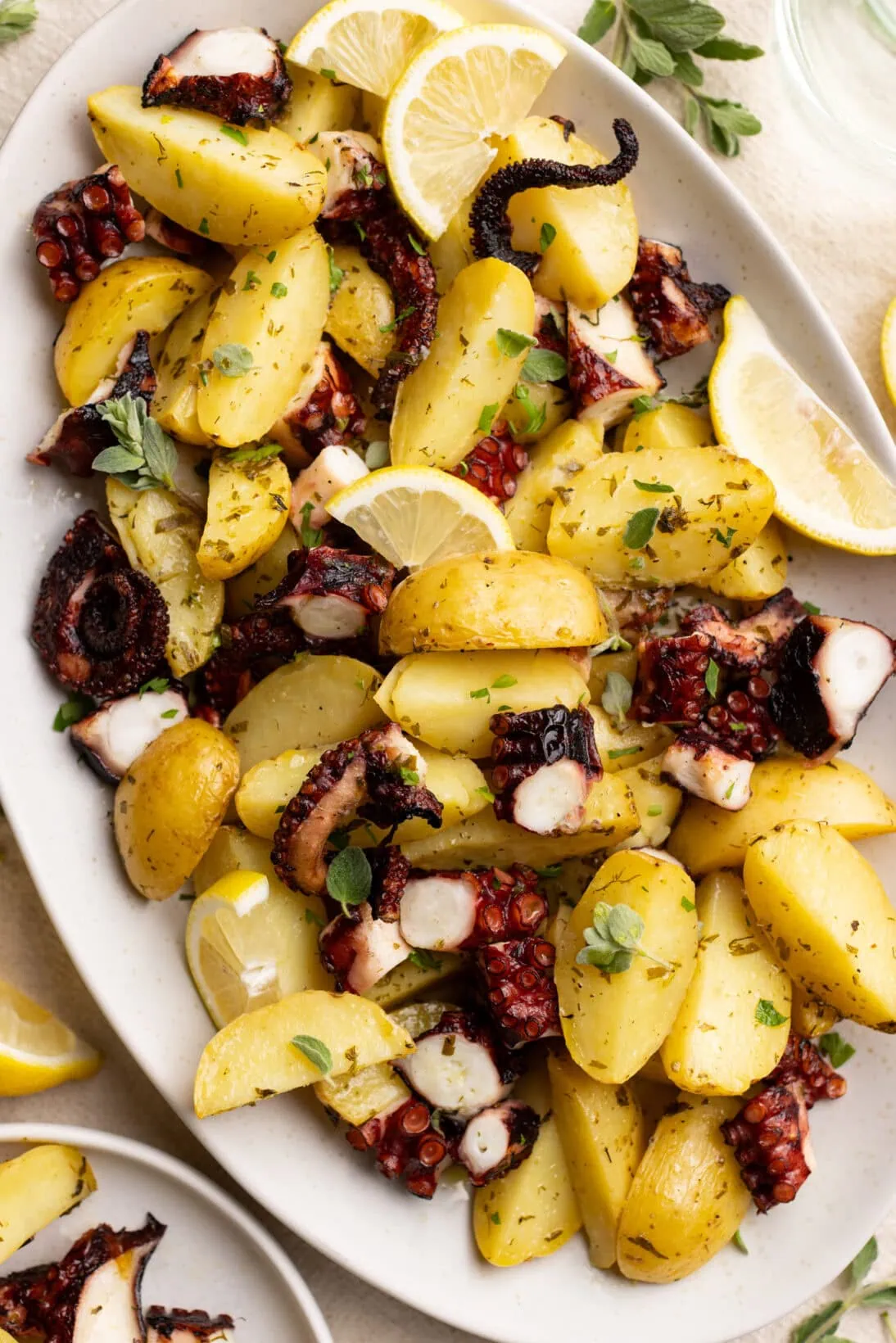 A platter of Greek lemon potatoes with octopus