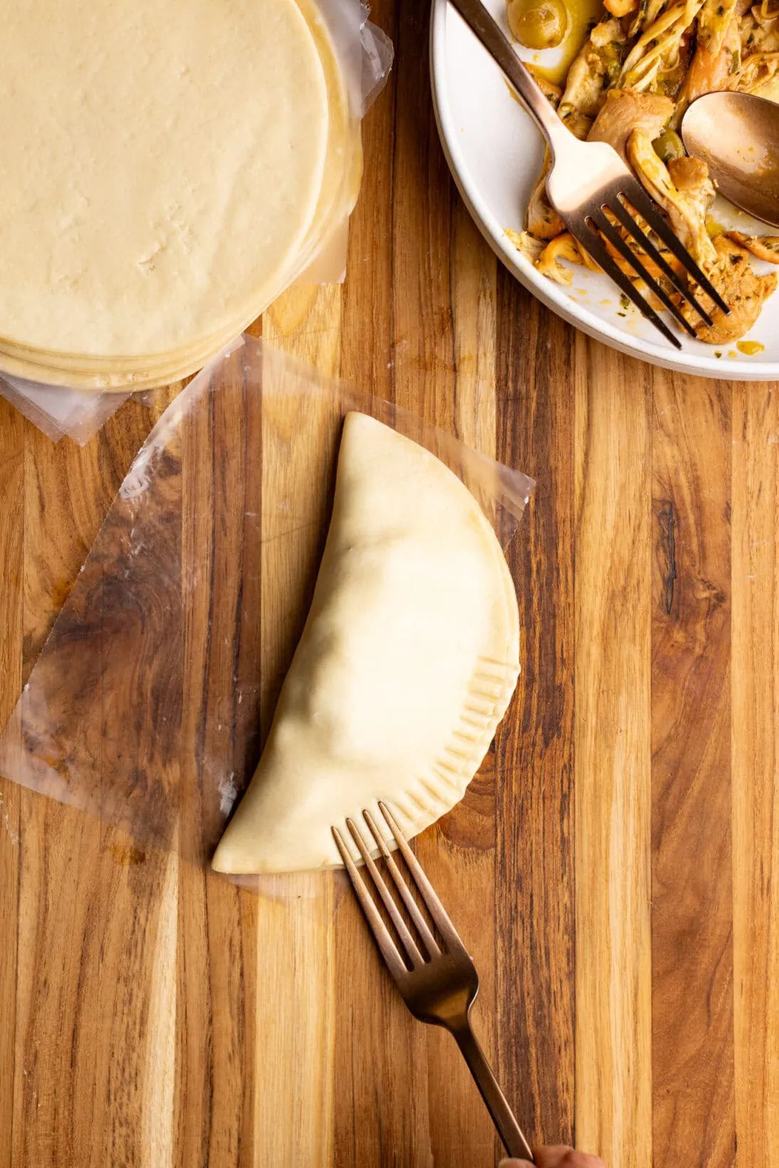 step by step: crimping the edges of the empanada