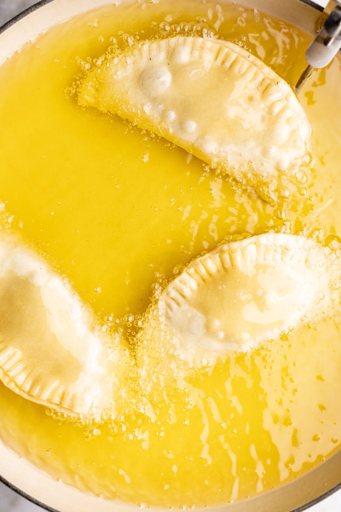 step by step: frying the chicken empanadas