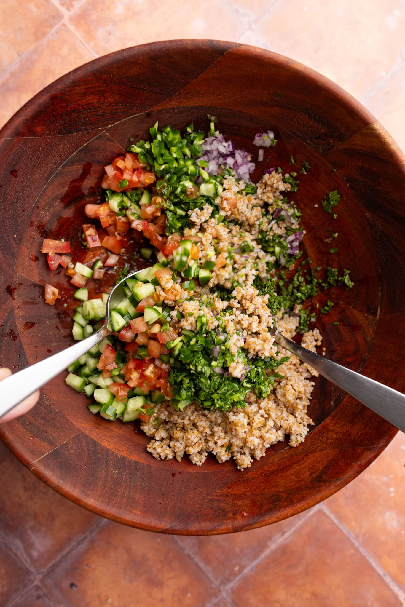 mixing the tabbouleh salad
