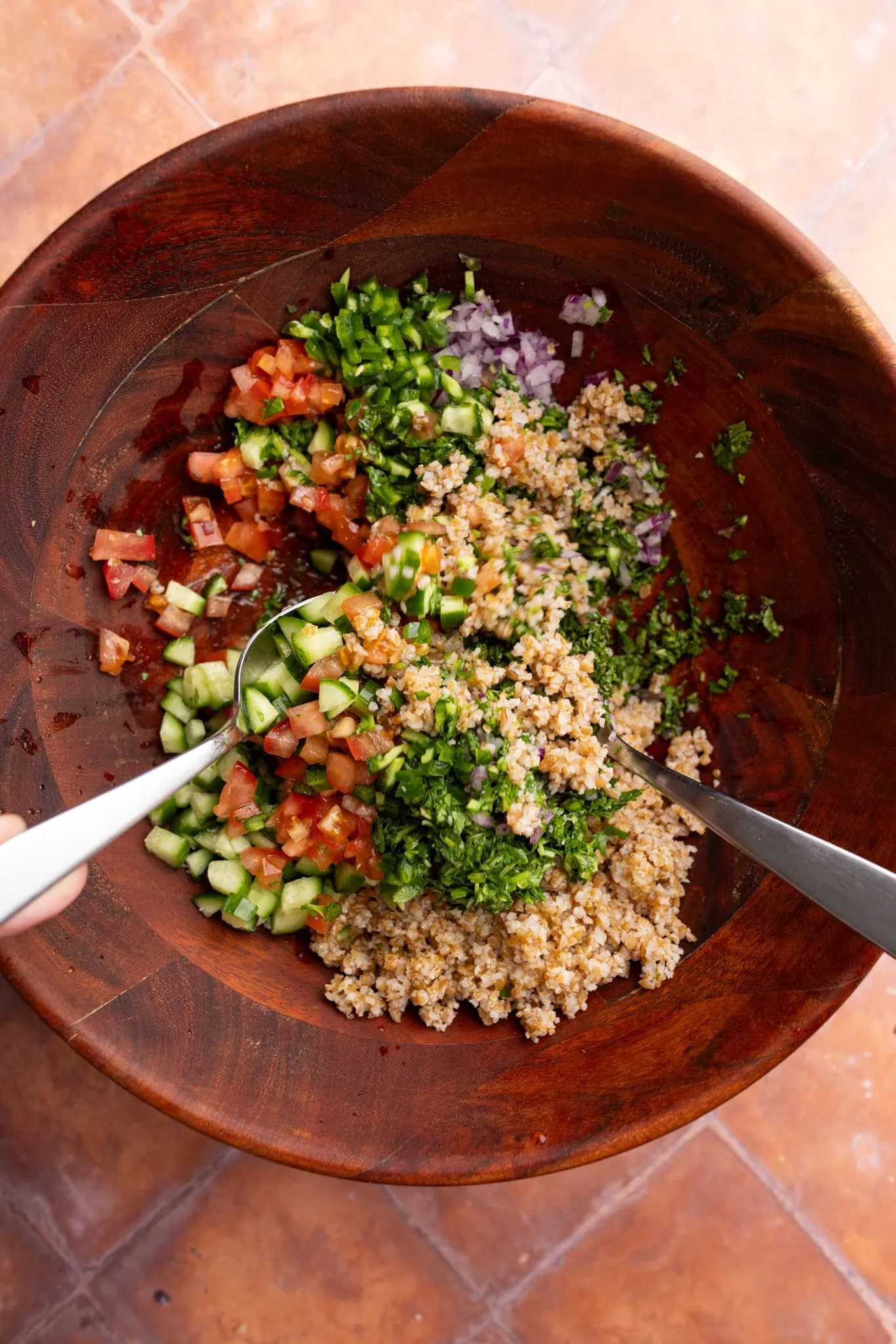 mixing the tabbouleh salad