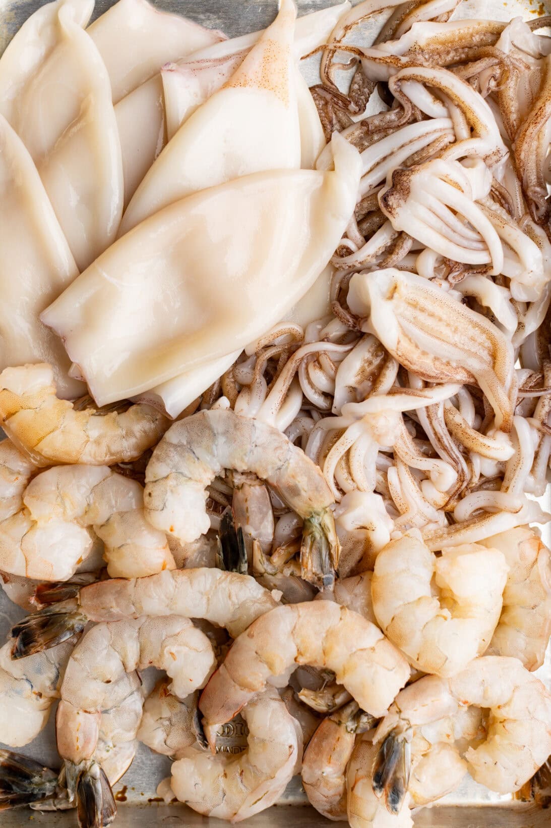 raw seafood: squid tentacles and tubes, and shrimp