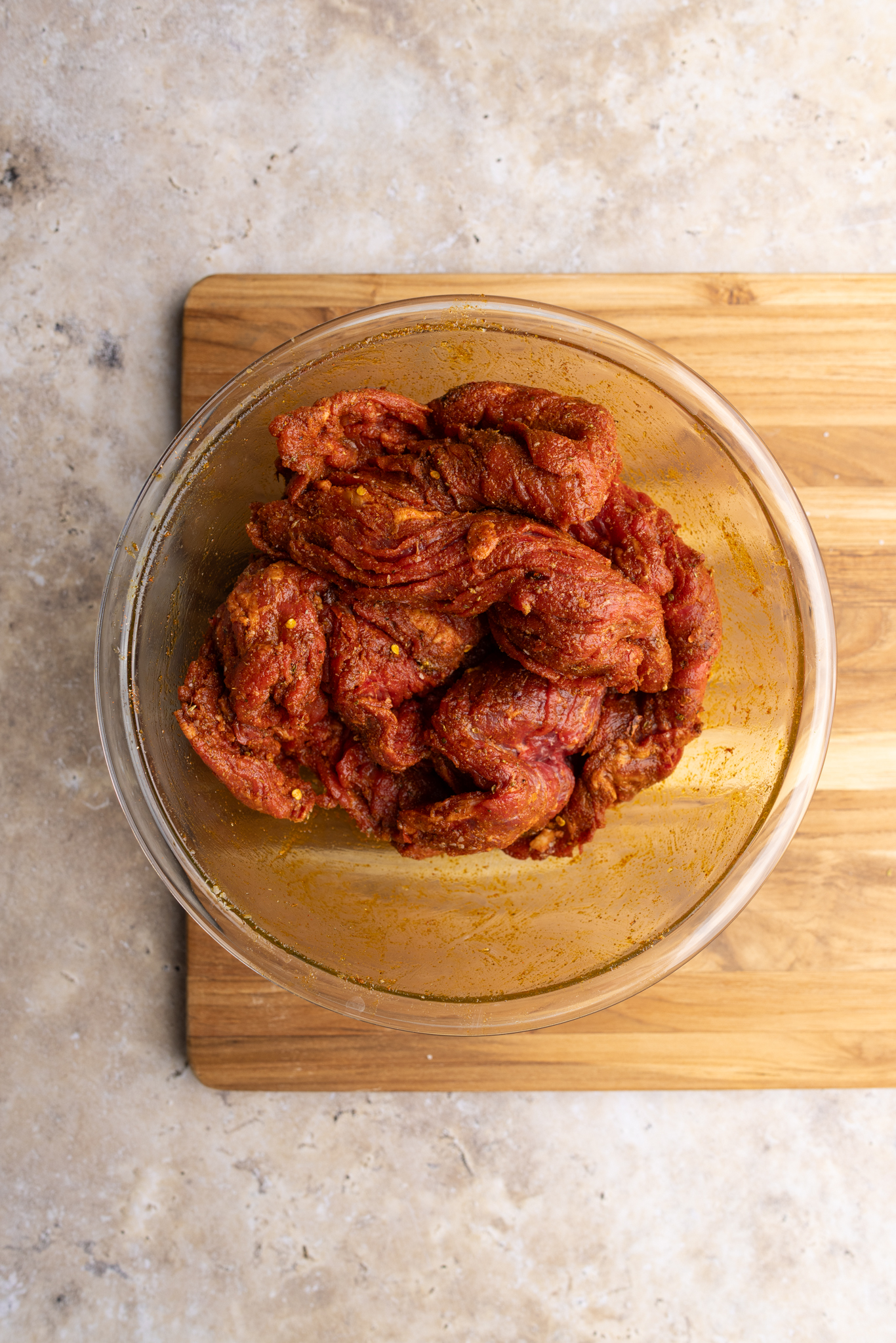 step by step: skirt steak throughly coated in the shawarma seasoning.