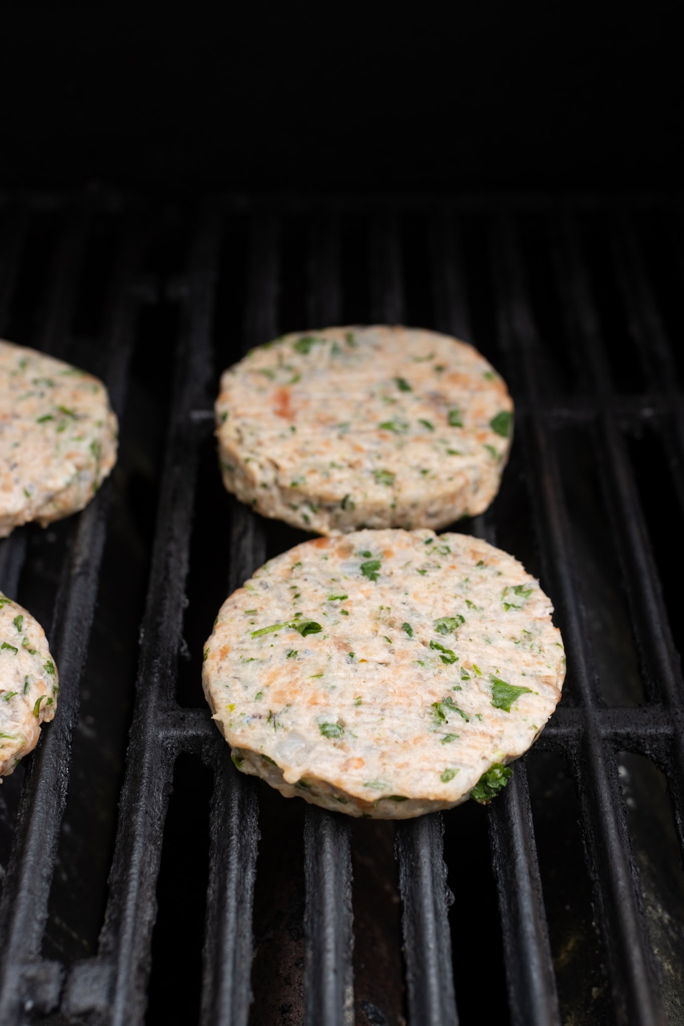step by step: grilling the raw bugers