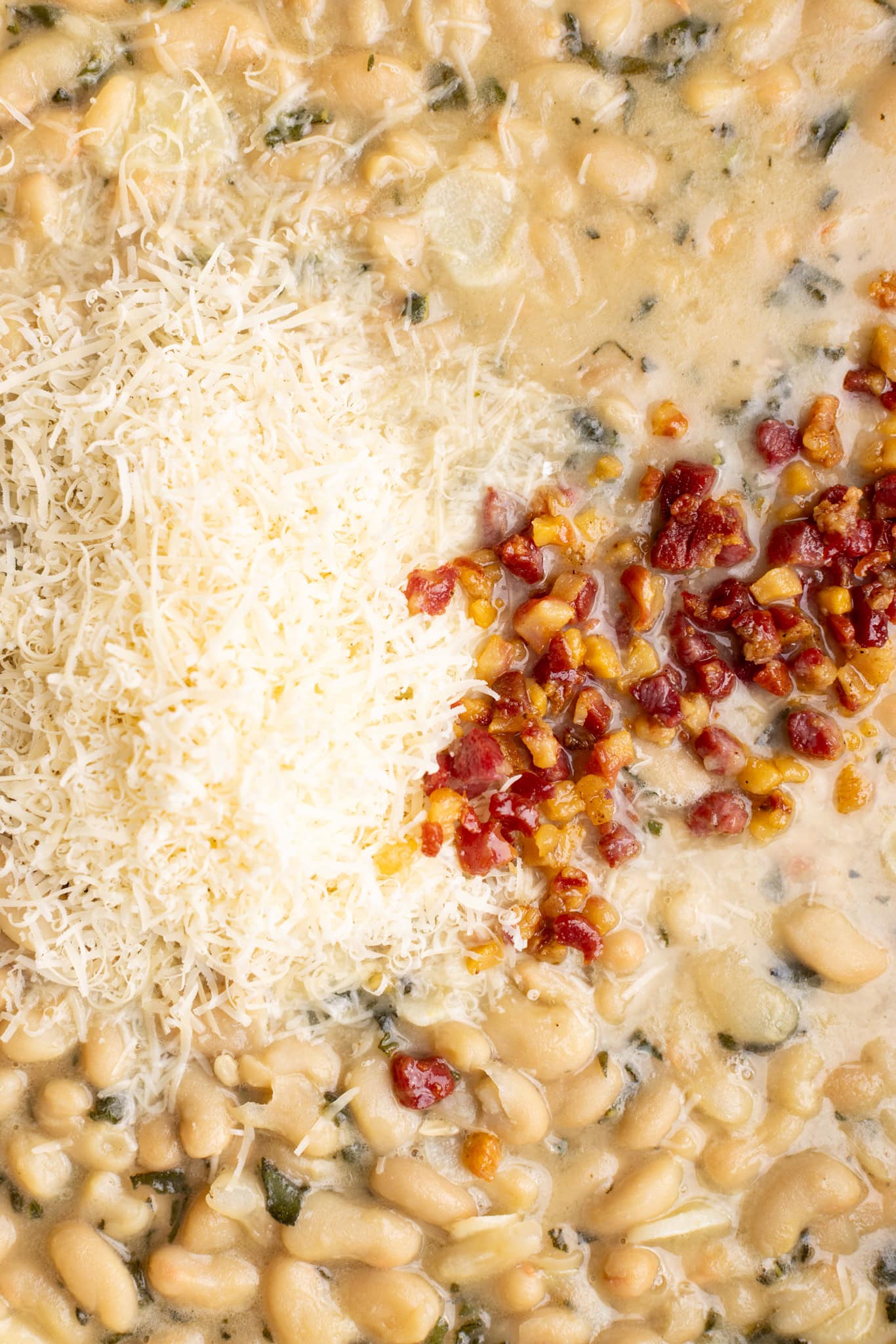 step by step: additional Parmesan cheese and the cooked pancetta added back to the beans