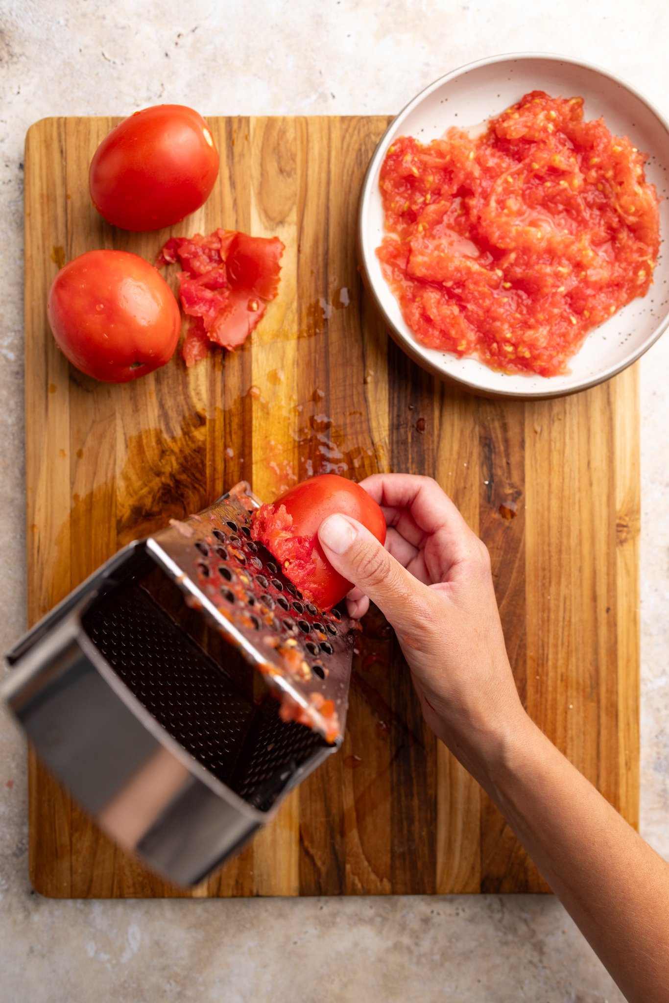 grating the tomato.
