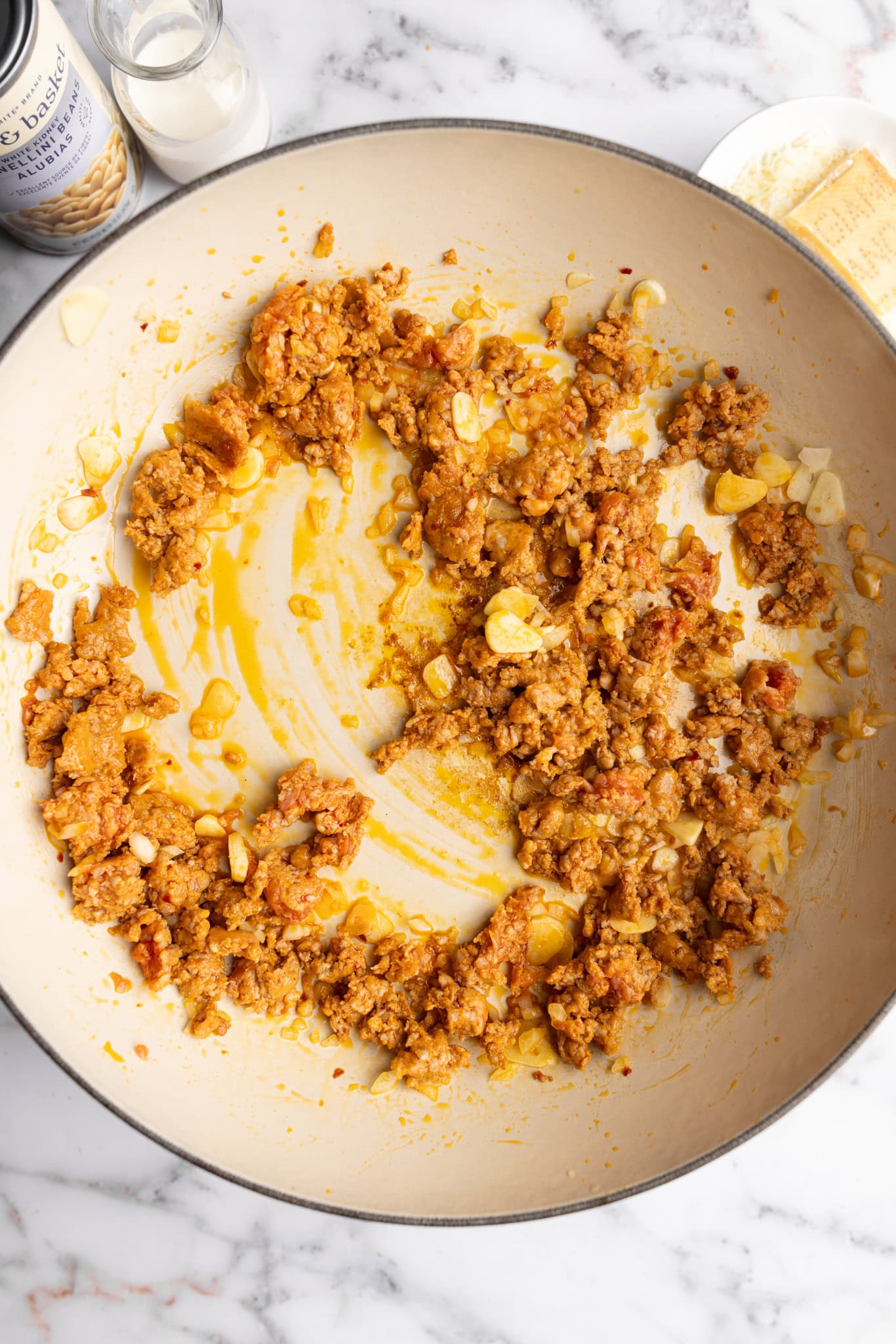 step by step: sautéing the sausage with onions and garlic.